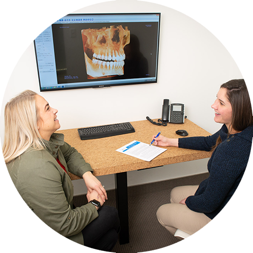 dental patient looking at xray of jaw and teeth